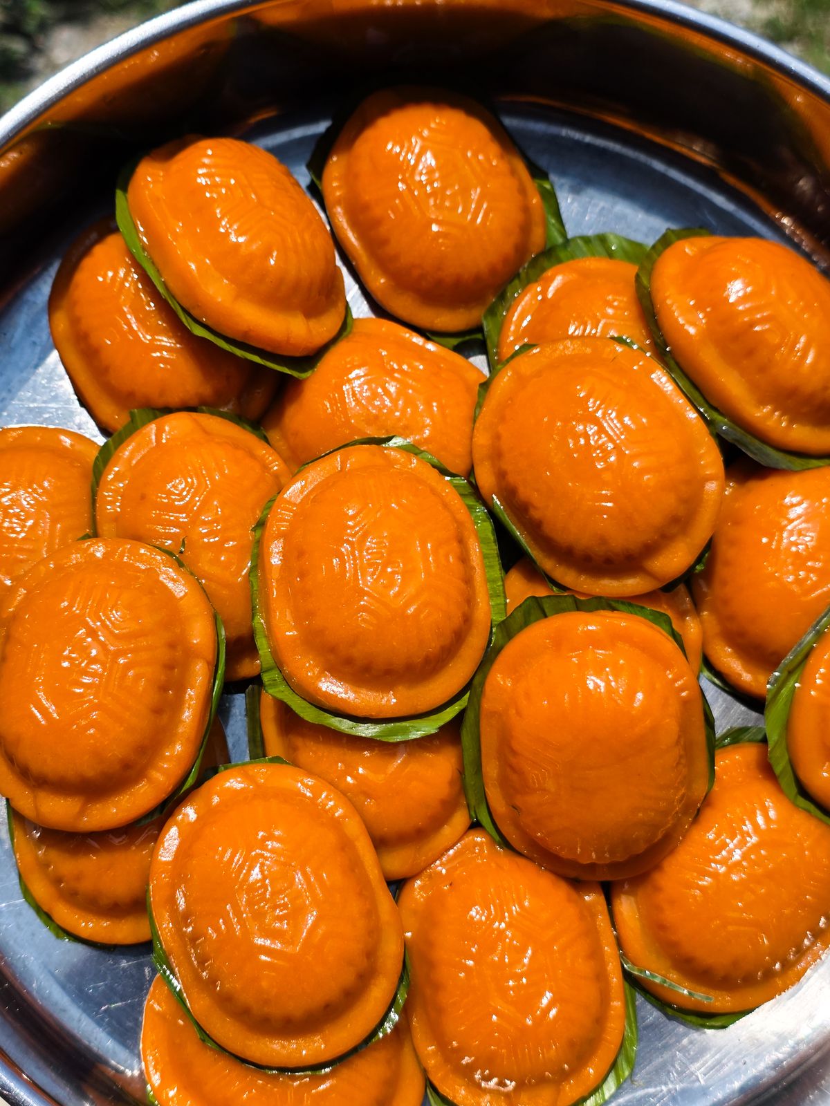 Orange ang ku kuih on banana leaf