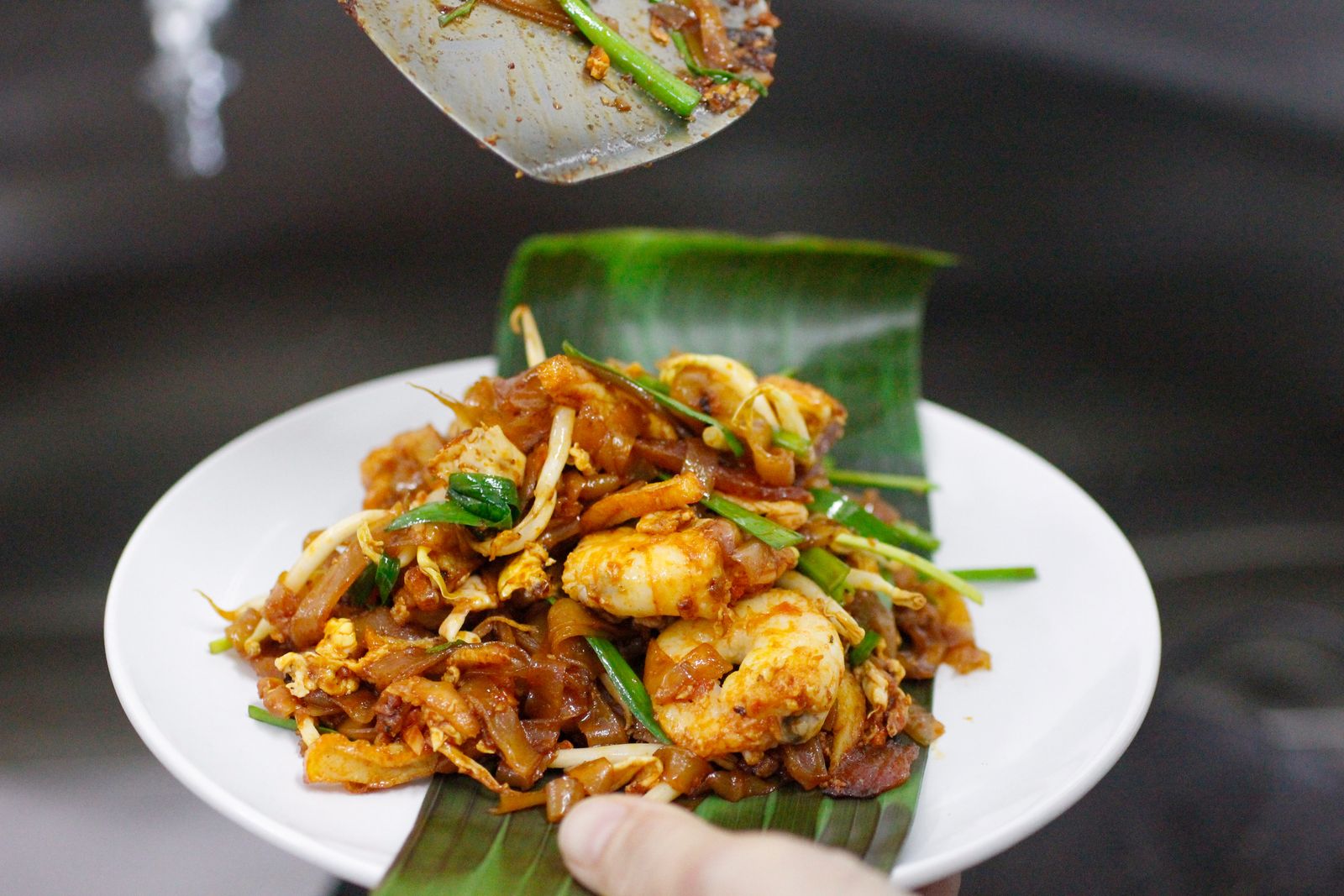Penang char koay teow on a banana leaf