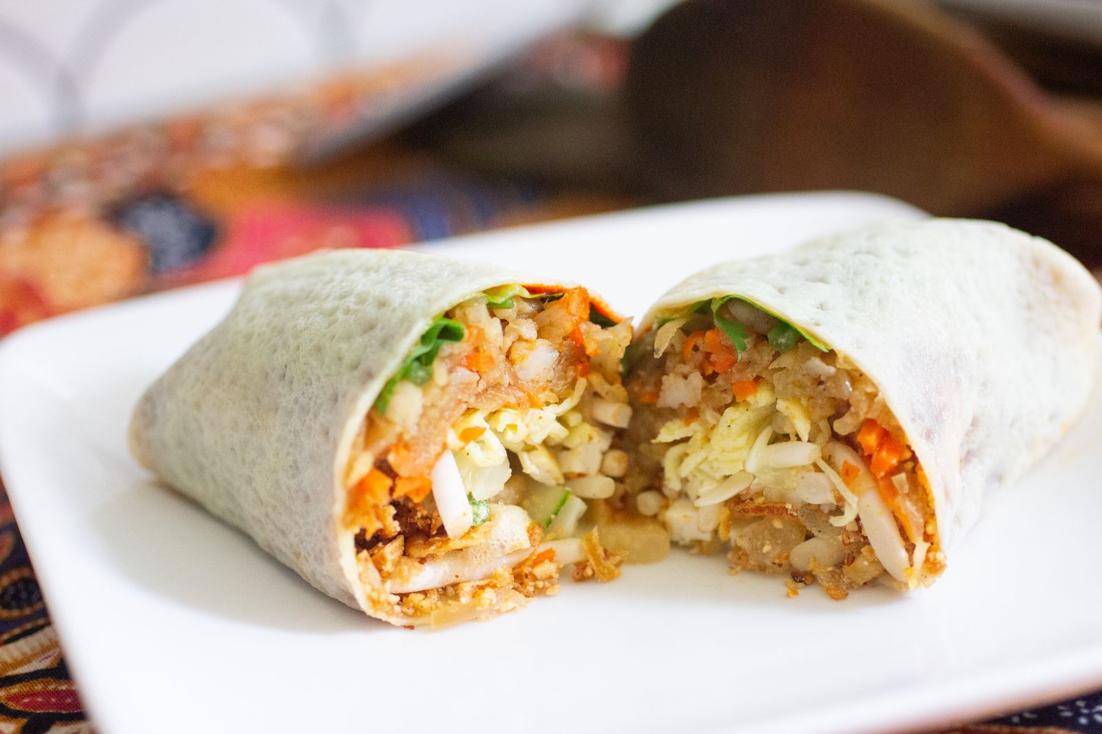 Nyonya popiah cut in half showing the filling